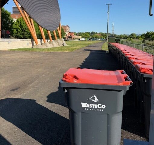 wasteco bins lined up on pavement