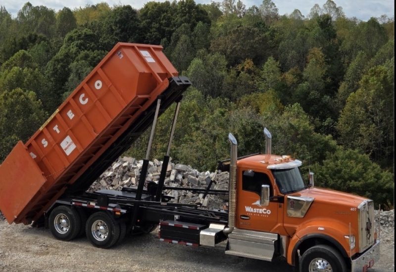 roll off dumpster demolition truck dumping debris