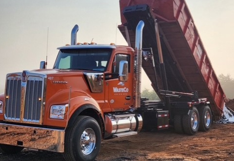 wasteco dump truck being emptied